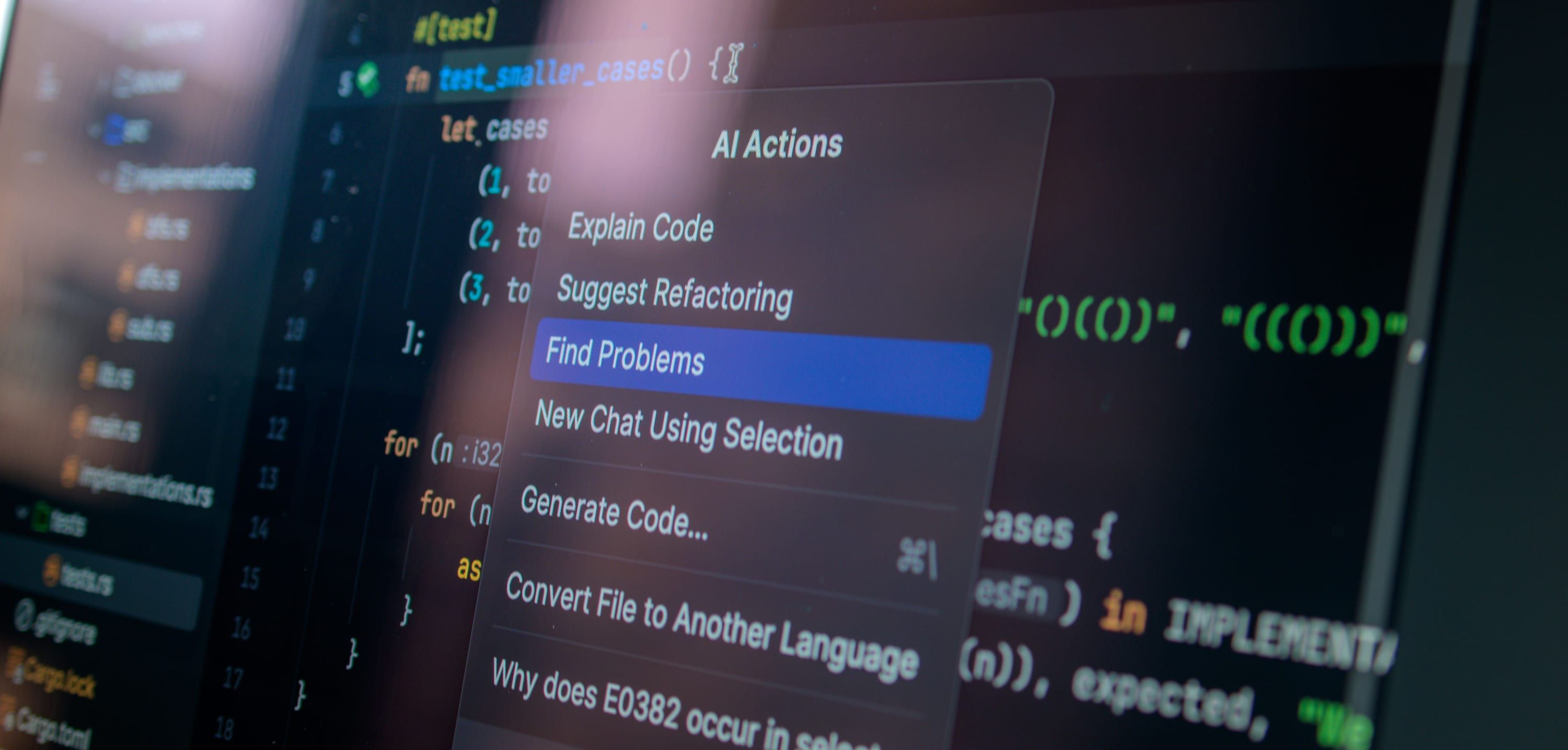 A code editor filling the frame at a shallow angle, an assistant menu open over the file, the panels behind it falling out of focus.